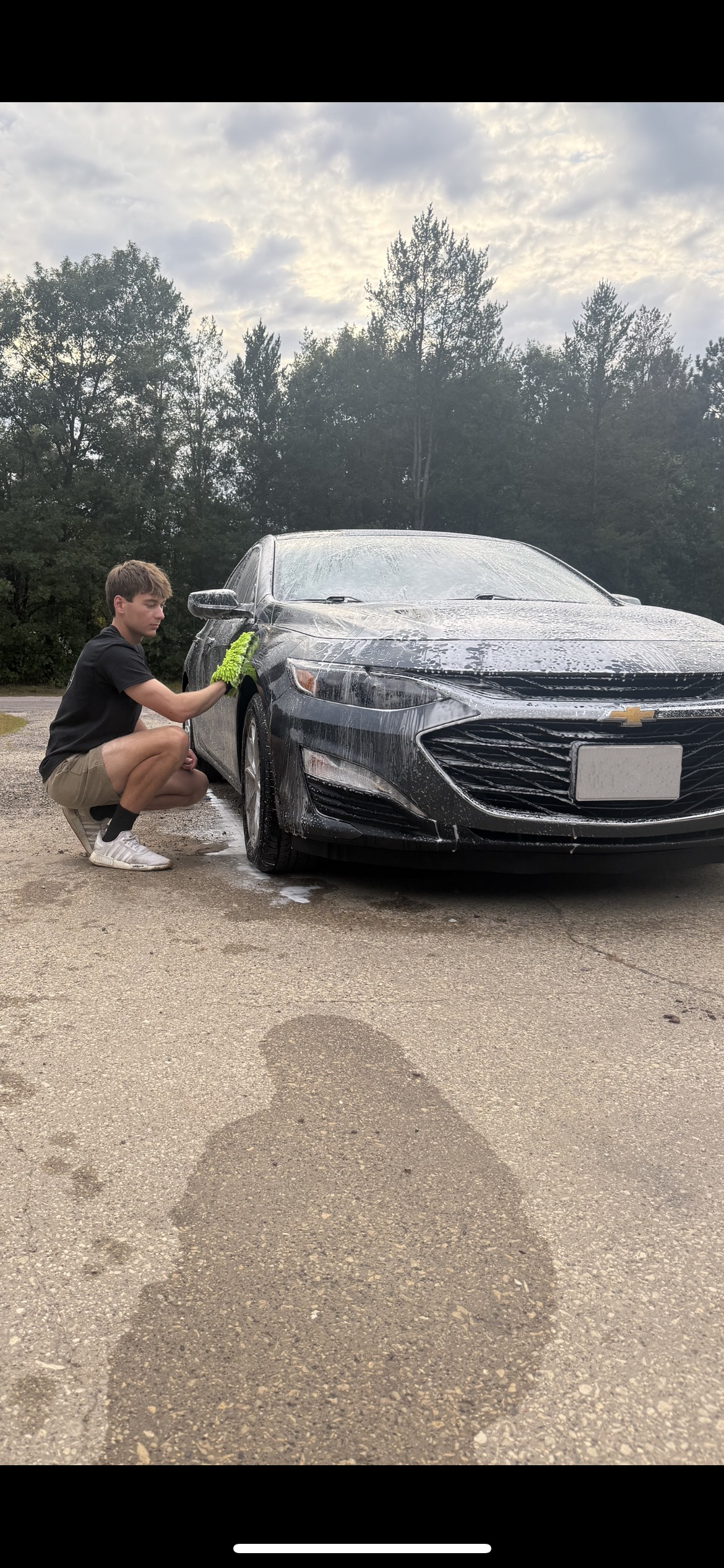Upscale Ballantyne driveway while a vehicle is being detailed